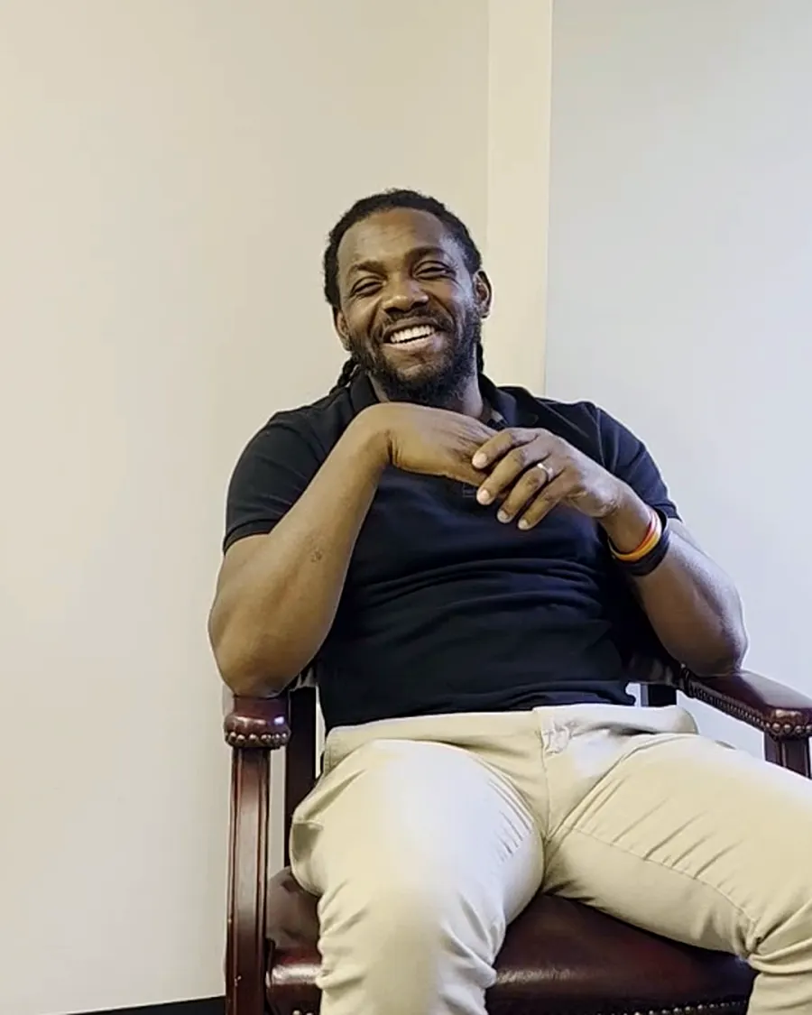 Wilson Pierre, IT Manager at RAS Medical Solutions, laughing during his interview