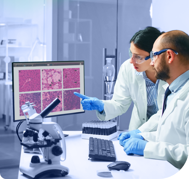 lab technicians using anatomic pathology lab software to analyze anatomic pathology report